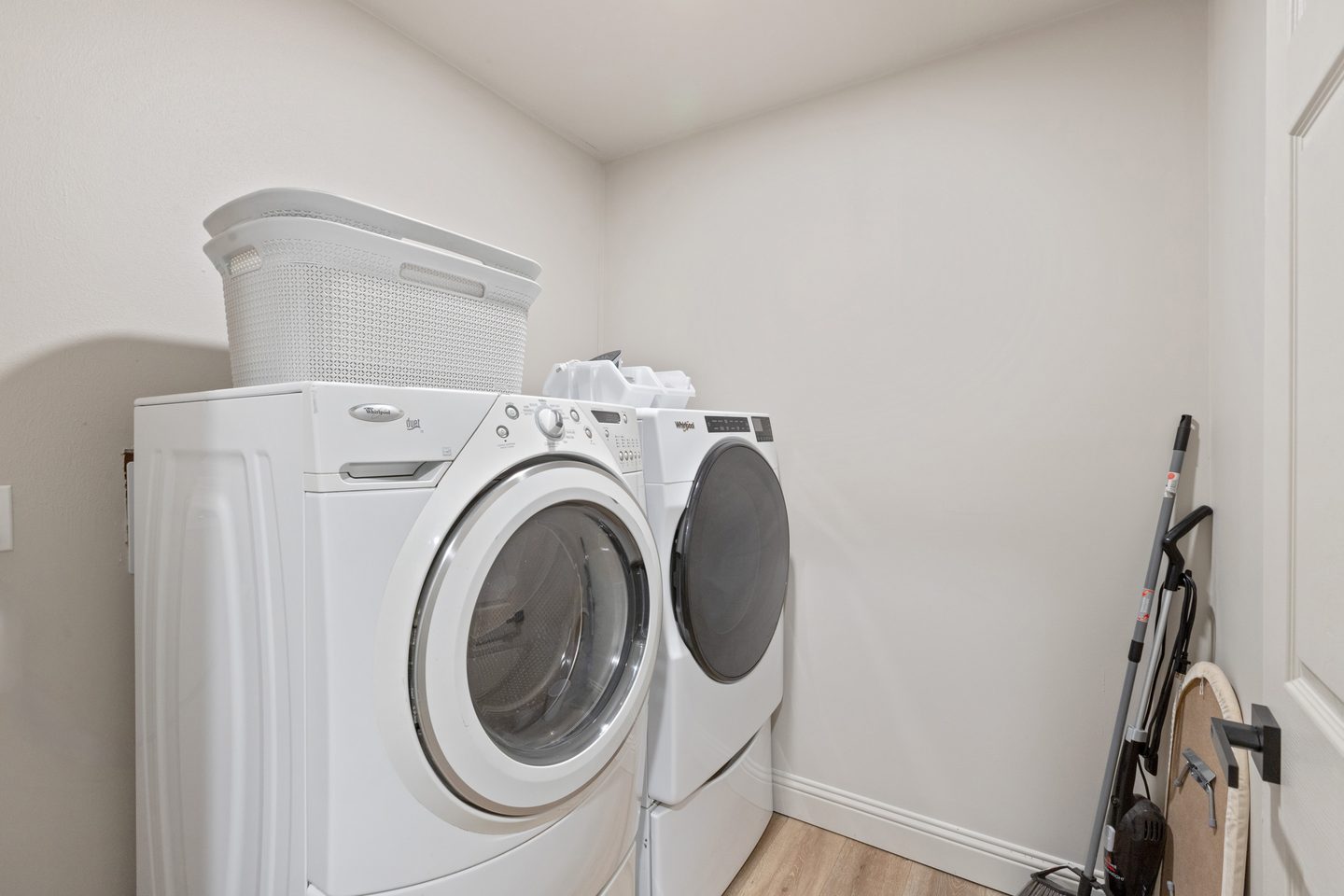 Laundry room with a front-loading washer and dryer